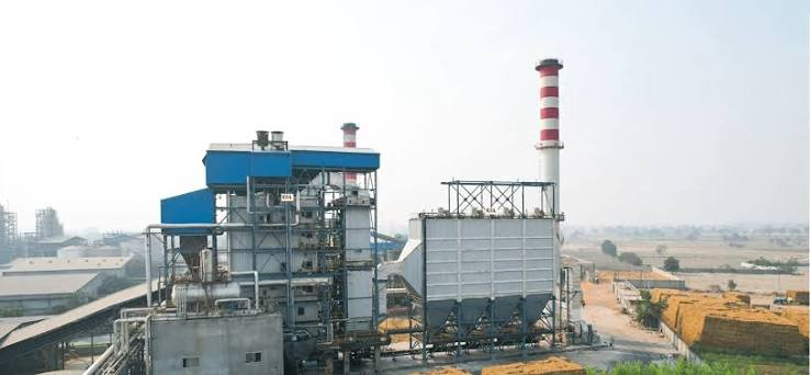 Biomass-fired boiler plant installation with fuel handling and pollution-control equipment